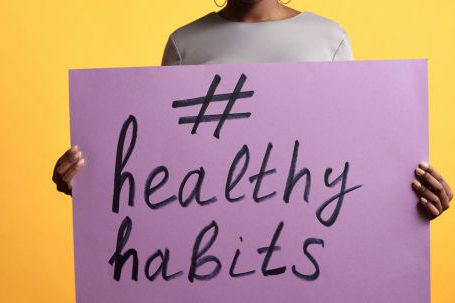 Healthy Habits - Person Standing and Holding a Poster